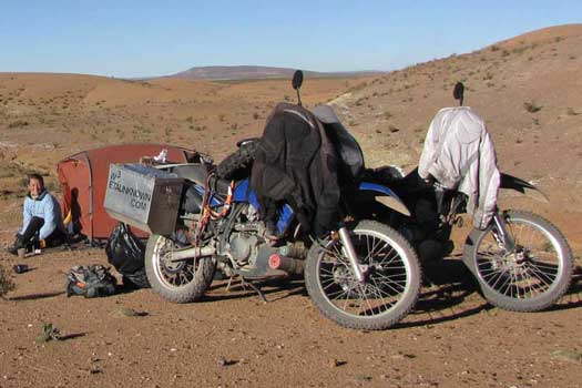 Desert with tent and two motorcycles