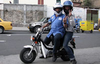 two people riding a motorcycle