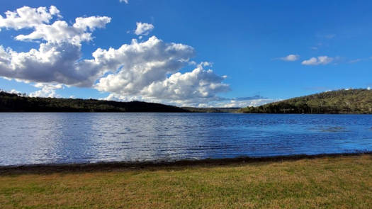 Lake under clear blue skies