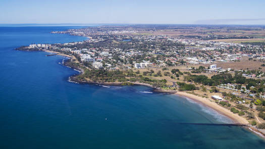 Looking down at coastline with built up apartments