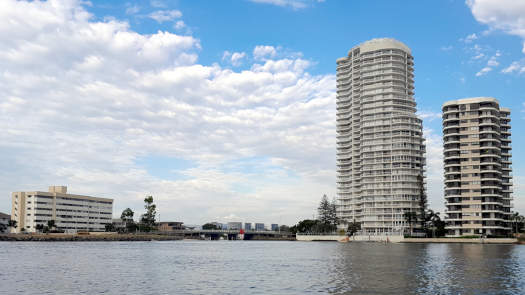 tall buildings beside a creek