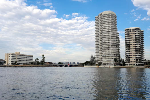 tall buildings beside a creek