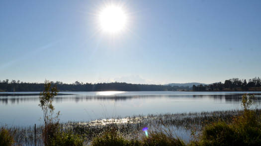 Lake under clear blue skies