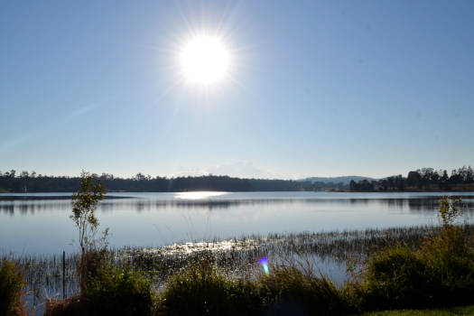 Lake under clear blue skies