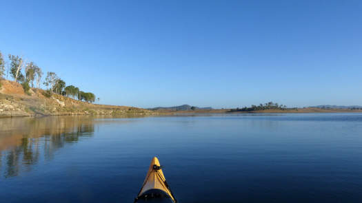 Lake under clear blue skies