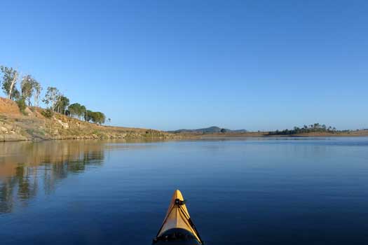 Lake under clear blue skies